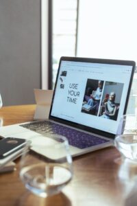 A laptop displaying a productivity presentation in a modern workspace.